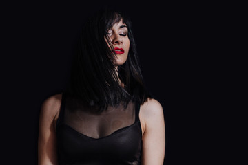 Naklejka premium woman posing on black background