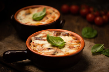 Lasagna dish on a rustic table. Food, mozzarella.