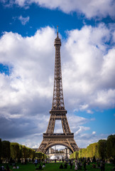 Fototapeta na wymiar Eiffel tower in paris with people on Champ de Mars