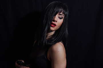 woman posing on black background