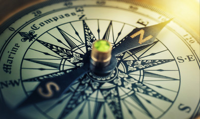 Old compass. Macro shot, shallow focus. Travel, geography, navigation, tourism and exploration concept background.