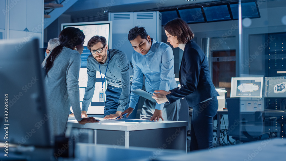 Poster Engineers Meeting in Technology Research Laboratory: Engineers, Scientists and Developers Gathered Around Illuminated Conference Table, Talking and Finding Solution. Industrial Design Facility