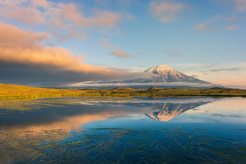 Tolbachik volcano reflection in the quiet mountain lake, Kamchatka