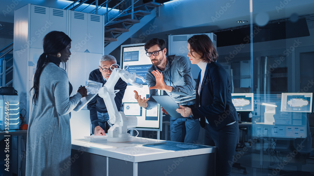 Poster Engineers Meeting in Robotic Research Laboratory: Engineers, Scientists and Developers Gathered Around Illuminated Conference Table, Talking, Using Tablet and Analysing Design of Industrial Robot Arm