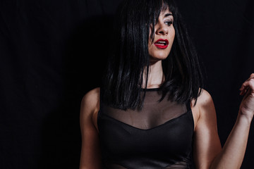 Naklejka premium woman posing on black background