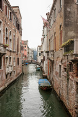 Fototapeta na wymiar Narrow channel view in Venice