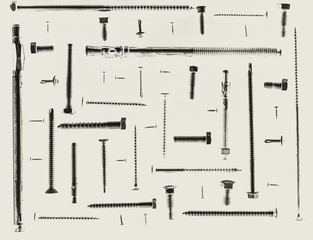 arious size and type of screws arranging at 90 degree angles from each other on white background, monochromatic