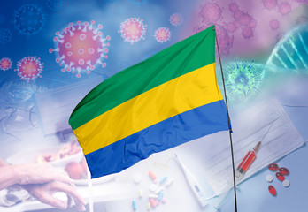 Coronavirus (COVID-19) outbreak and coronaviruses influenza background as dangerous flu strain cases as a pandemic medical health risk. Gabon Flag with corona virus and their prevention.