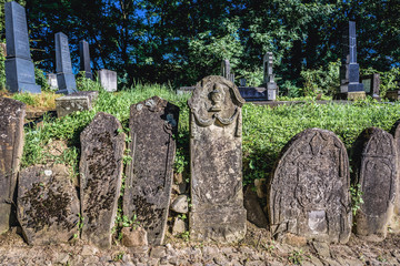 Old graves on a cemetery next to so called Church on the Hill in Sighisoara city located in Mures County, Romania