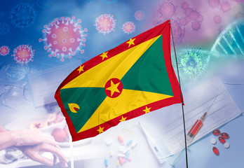 Coronavirus (COVID-19) outbreak and coronaviruses influenza background as dangerous flu strain cases as a pandemic medical health risk. Grenada Flag with corona virus and their prevention.