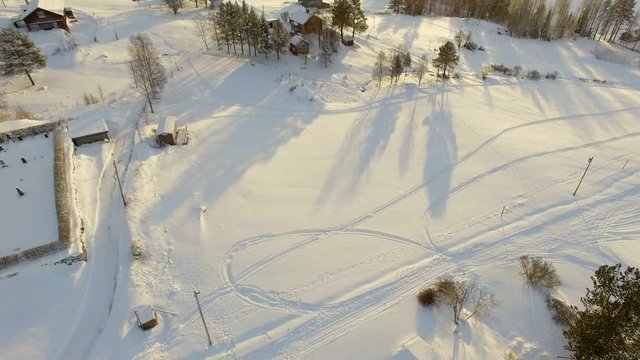 Cinematic aerial revealing a beautiful winter landscape during golden hour