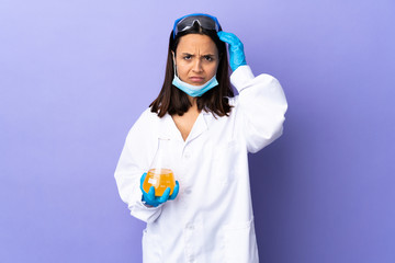 Scientist woman investigating a vaccine to cure coronavirus disease with an expression of frustration and not understanding
