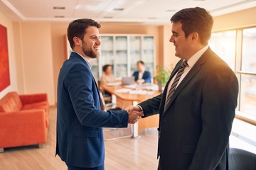 Business lawyers workers meeting at law firm office. Professional executive partners working on finance strategry at the workplace. Shaking hands for succesful agreement.