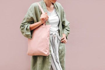 Woman holding canvas tote bag. Reusable eco bag. Eco friendly concept.