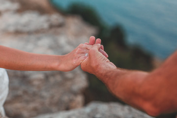 the intertwining of the hands of the bride and groom