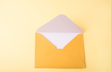 The yellow envelope for letters rests on a yellow background.