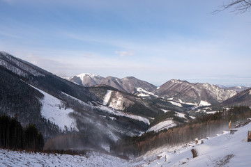 Ridge of Mala Fatra snowy with mountain Krivan in background and valley below, Slovakia Mala Fatra