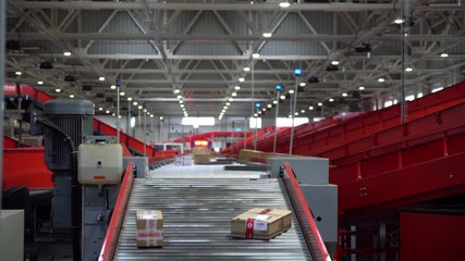 Postal Parcel Sorting Line, Postal Conveyor System, Parcels are Moving on Belt Conveyor at Post Sorting Office