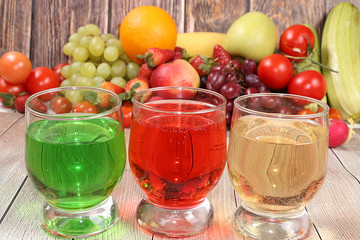 Citrus cider, juice, drinks and ingredients on a wooden table. The concept of detox diet and weight loss, healthy and natural foods. Summer drinks, vitamins C, immunity protection