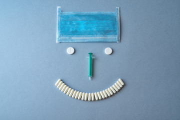 Syringes and tablets on a blue background. Medical concept