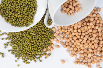 Green mung bean and turkish peas with white cups on the table. Asian ingredients of traditional dishes