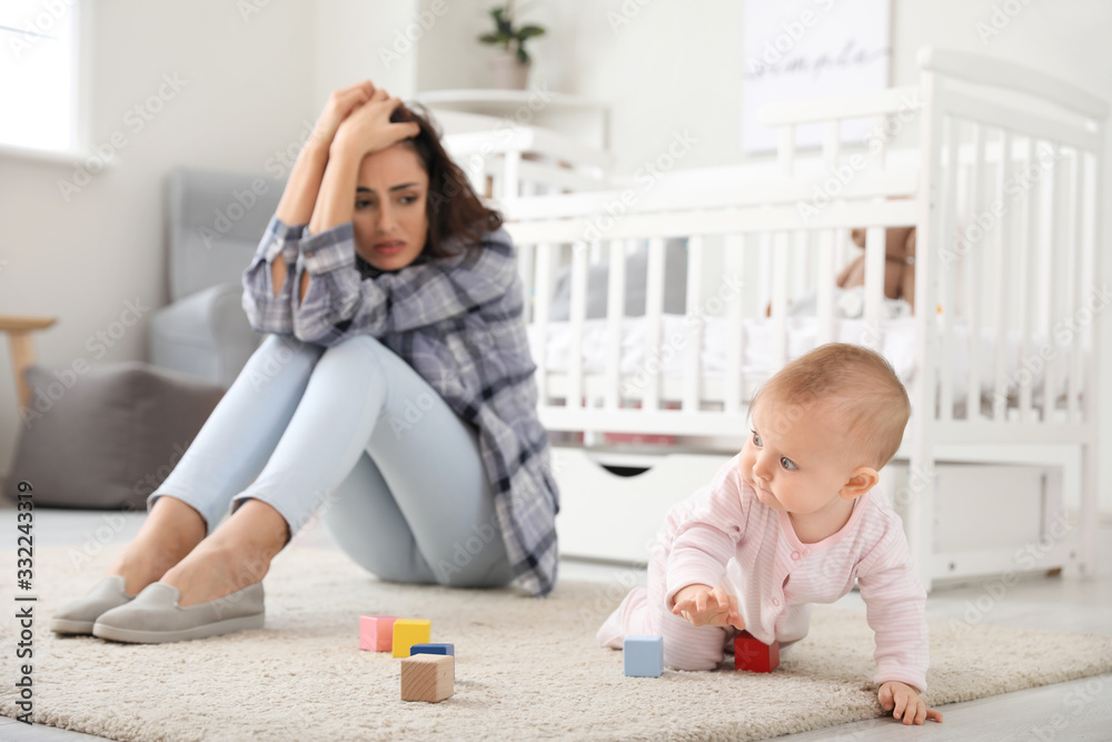 Poster Young woman suffering from postnatal depression at home