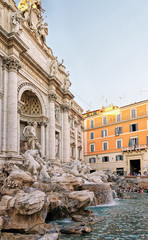 Fototapeta na wymiar Trevi Fountain and tourists in Rome in Italy
