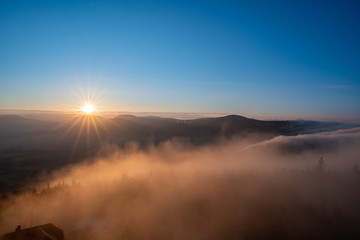 sunrise in mountains with fog and beautiful clear sky, czech Beskydy, Velky Javornik