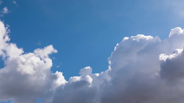 time lapse with white clouds forming on sunny blue sky, 4k