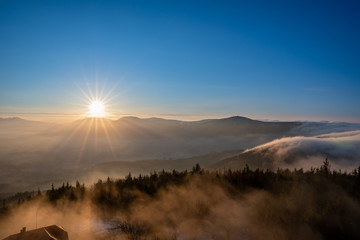 sunrise in mountains with fog and beautiful clear sky, czech Beskydy, Velky Javornik