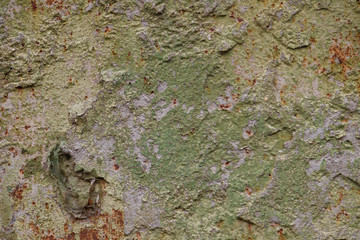 Old rusted weathered and uneven stone wall texture background or backdrop