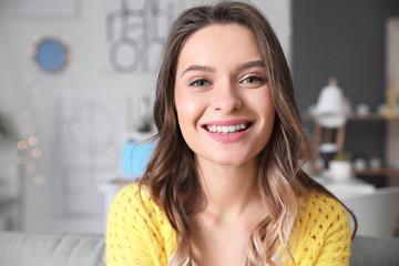 Young woman using video chat at home