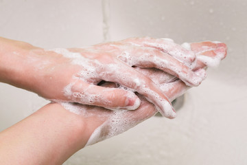 Cleaning hands with soap and water. Removing dirt, germs and bacteria from the skin. Hand washing with soap. Protect your health from flu and viruses.