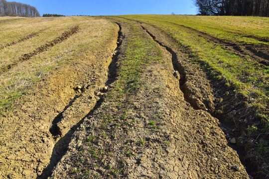 Water erosion of grass field erosive soil damage