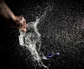 Exploding waterballoon against a black background