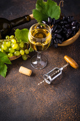 Grape, wine and vintage corkscrew