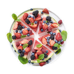 Sliced watermelon pizza isolated on white, directly above