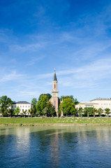 Fototapeta na wymiar A Church in Salzburg along the river