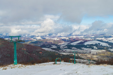 chairlift on a background of hills