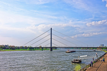 Oberkasseler Bridge and Rhine embankment promenade in Dusseldorf