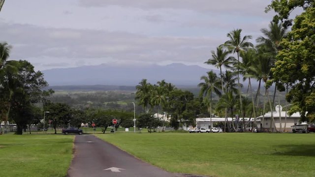 Big Mountain In Distance From Island Town