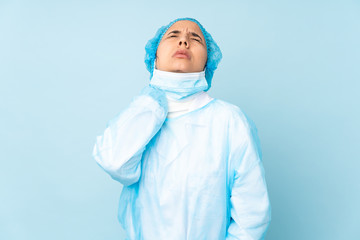 Young surgeon Indian woman in blue uniform with neckache