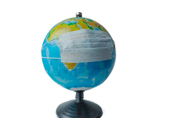 globe in medical mask on a white background