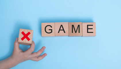 Game word wooden cubes on wooden background, mock up, template, banner with copy space for text