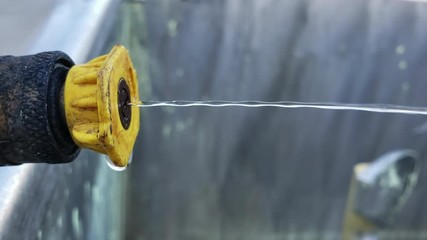 Water coming out of hose nozzle  - Powered by Adobe