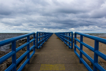 Fototapeta premium Metal bridge trail path in park symmetric