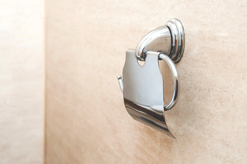 Empty toilet paper holder in the toilet. the paper is over