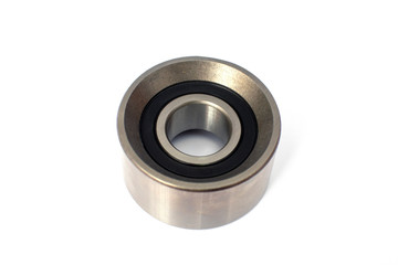 Tension roller of a timing belt of an internal combustion engine on a white background. Engine spare parts.