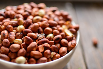 Peanuts in bowl and salt shaker