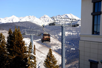 The gondola ski lift taking skiers up the mountain in Vail, Colorado. 